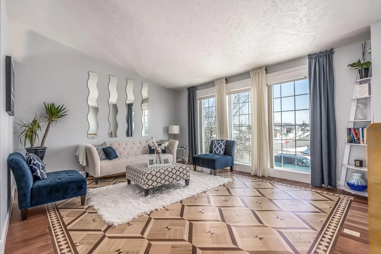 Living room with a custom patterned hardwood floor and decorative border